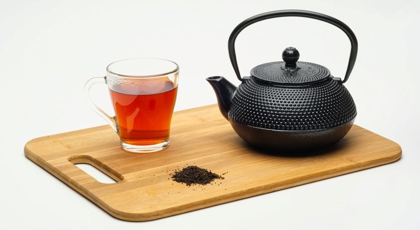 cast iron teapot and a cup of tea