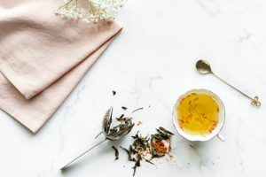 Herbal tea in a white ceramic teacup