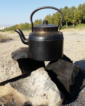 Teapot on campfire outdoors