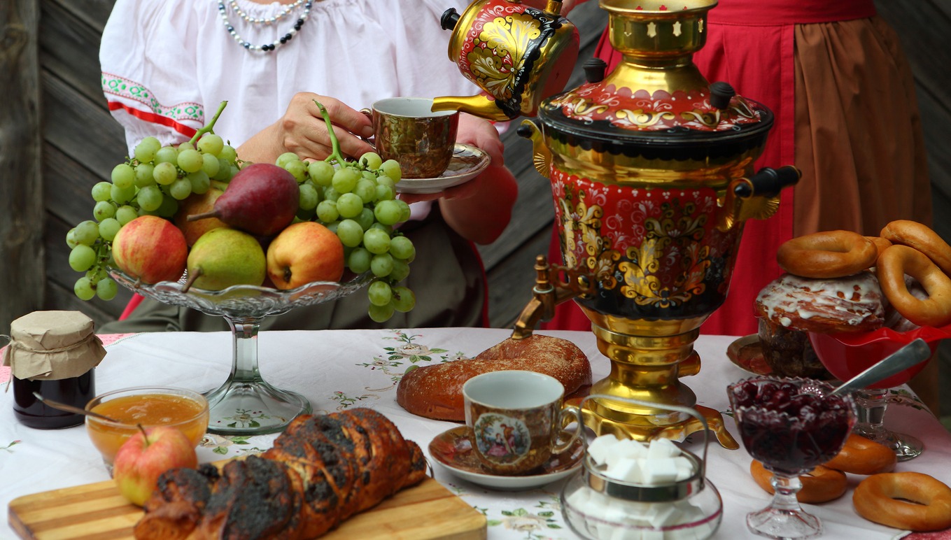 Still life with a samovar, tea and sweet pastries