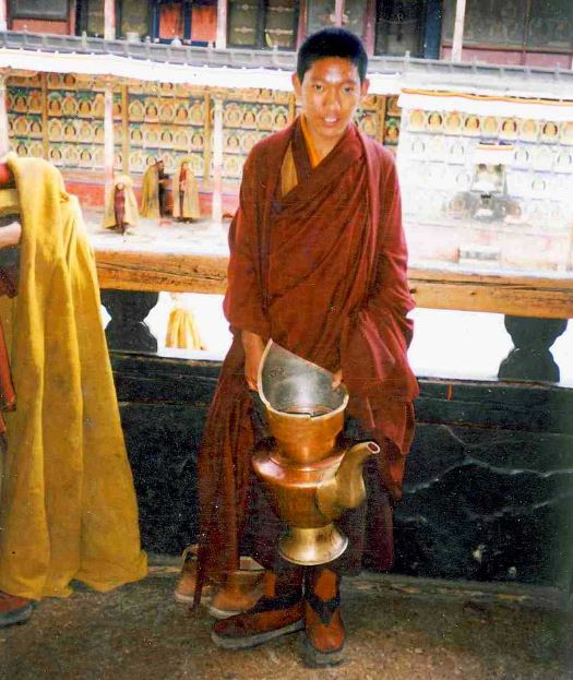 Novice Monk With Large Teapot